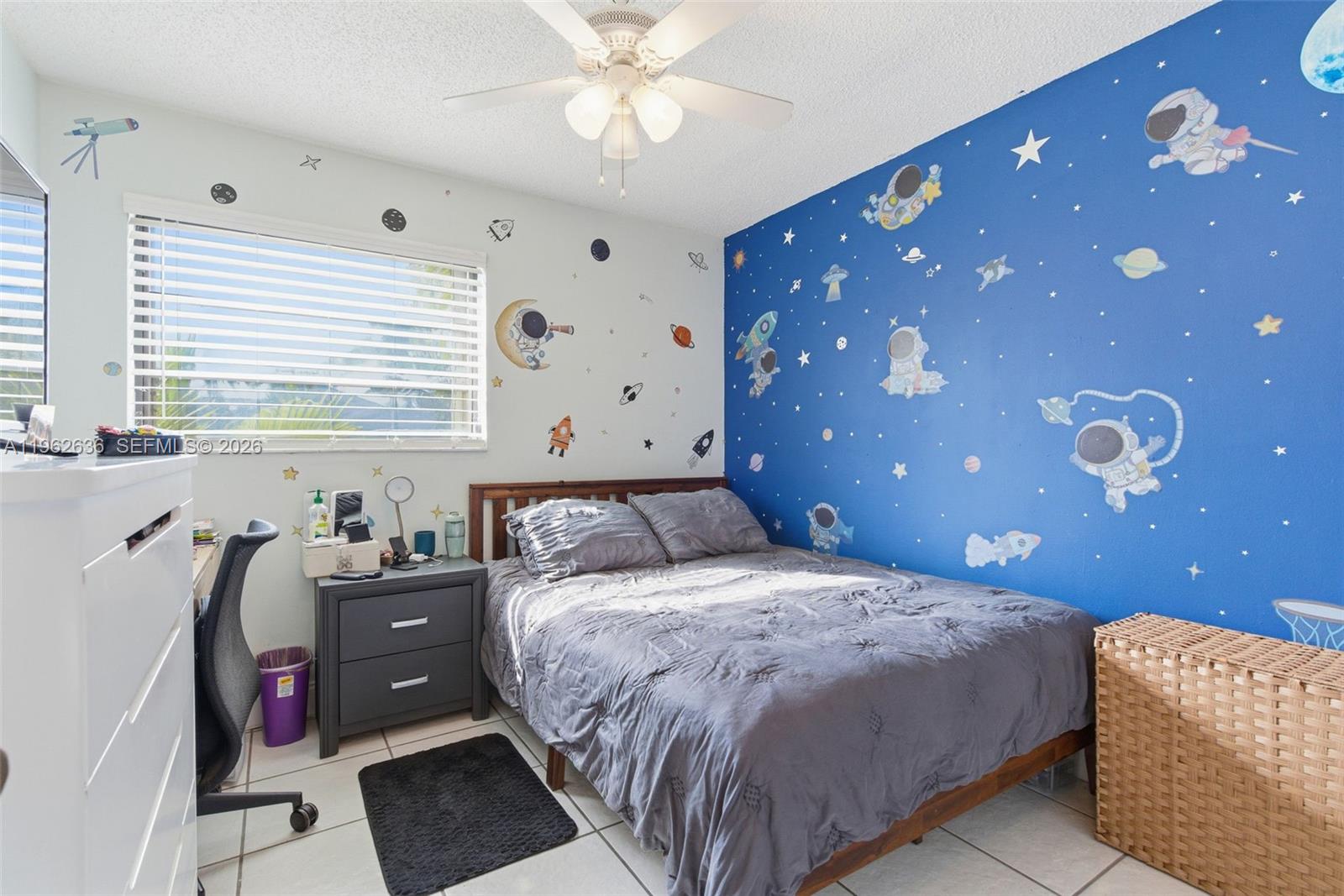 4726 Southwest 67th Avenue, Unit F6 Miami, FL 33155 - Photo 25 of 37 a bedroom with a bed and a window