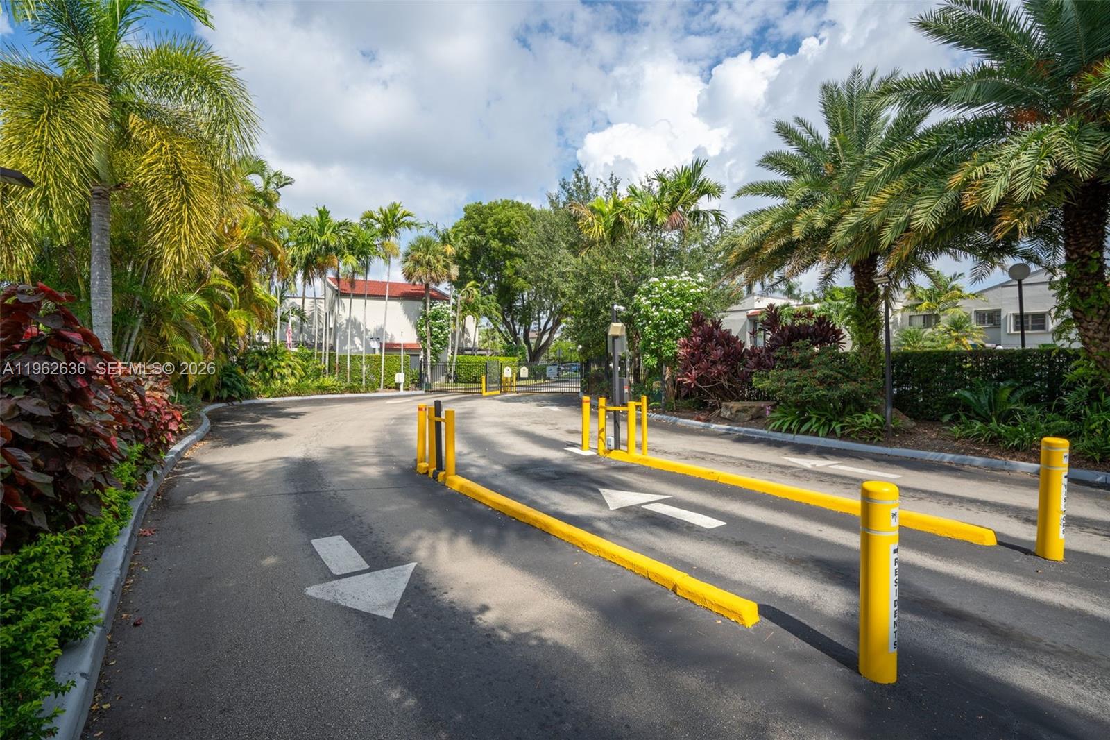 4726 Southwest 67th Avenue, Unit F6 Miami, FL 33155 - Photo 32 of 37 a view of a swimming pool with a bench and trees around