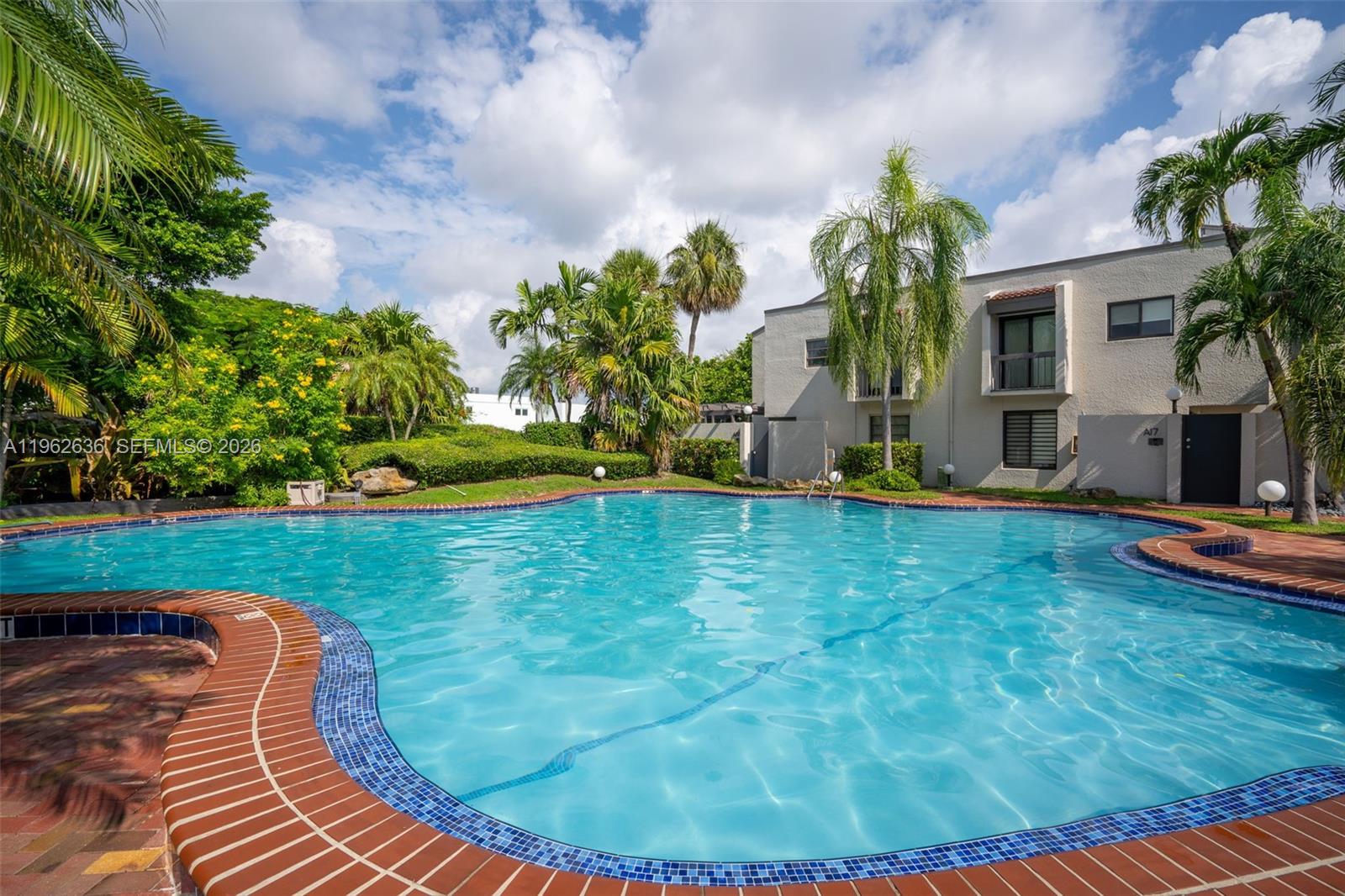 4726 Southwest 67th Avenue, Unit F6 Miami, FL 33155 - Photo 35 of 37 a view of a backyard with a garden