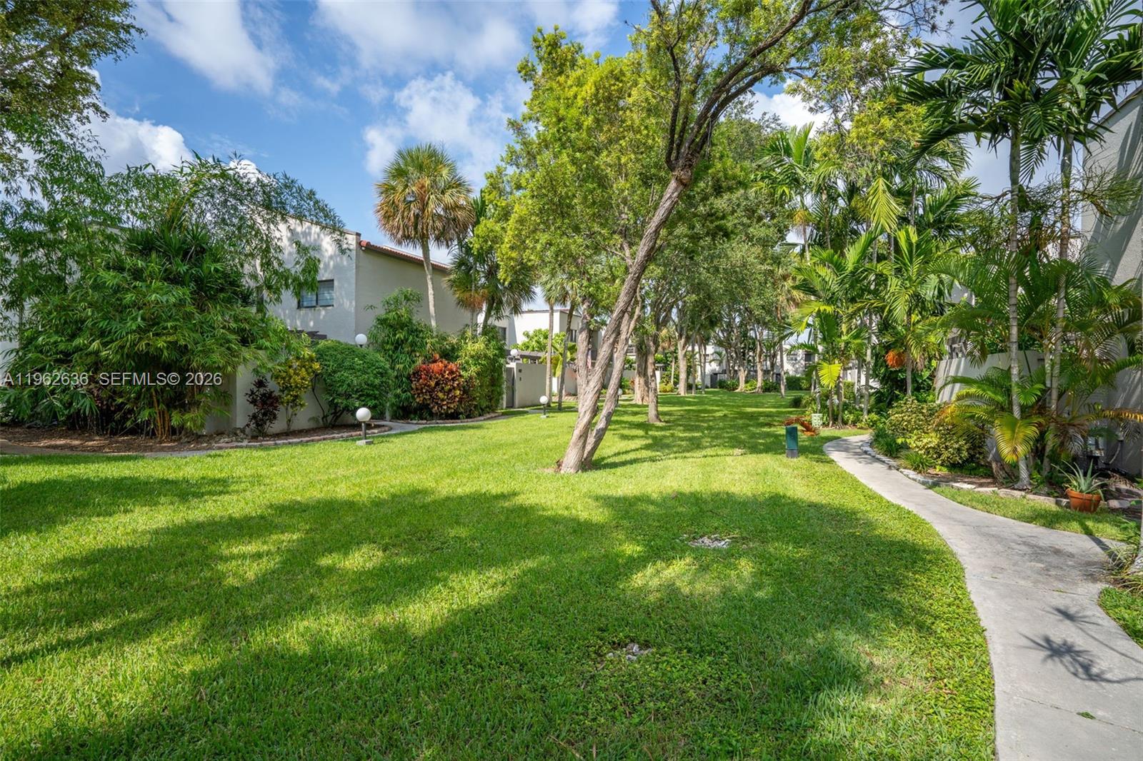 4726 Southwest 67th Avenue, Unit F6 Miami, FL 33155 - Photo 37 of 37 a view of a house with a backyard