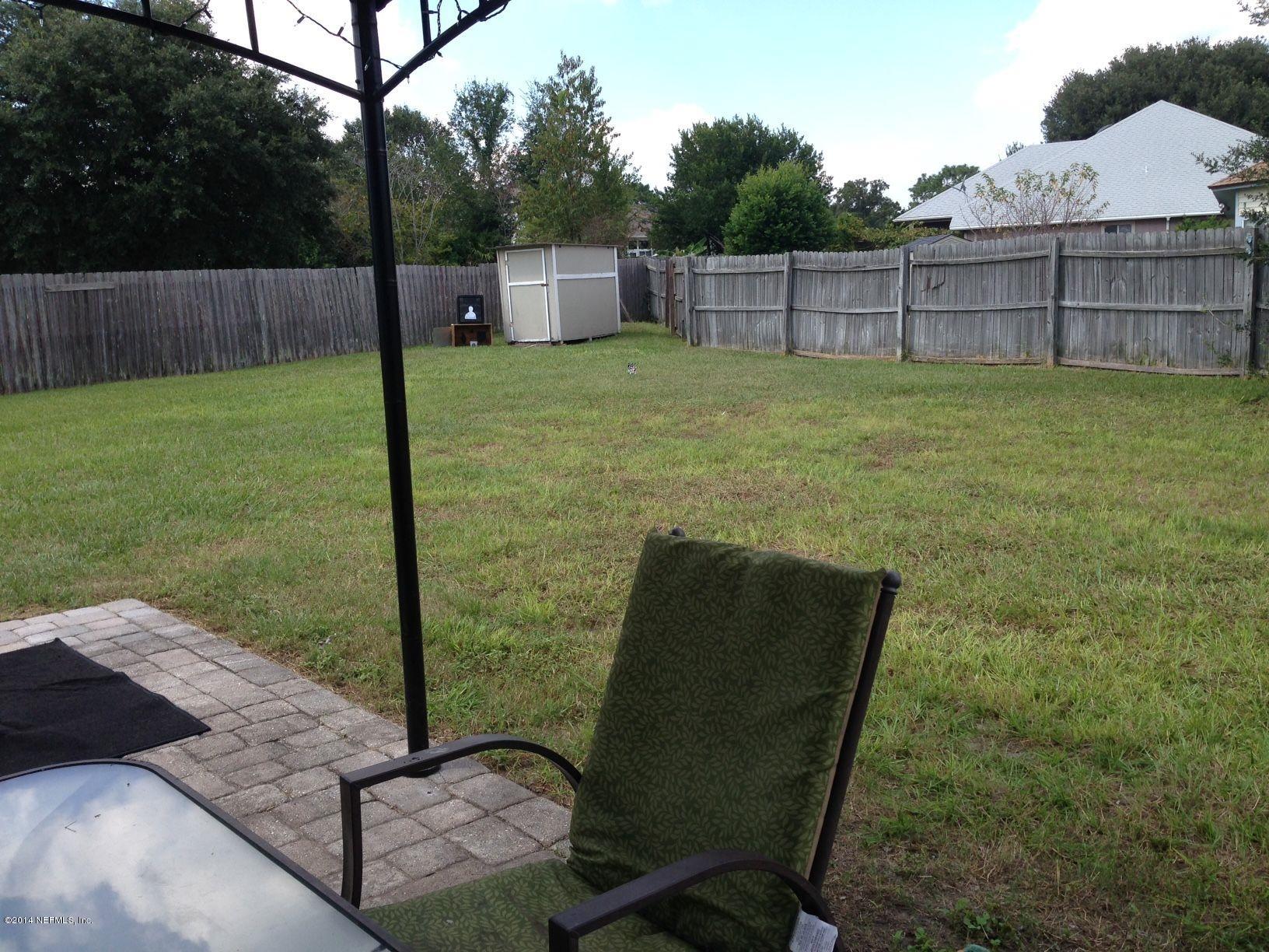 438 Federal Hill Road Orange Park, FL 32073 - Photo 13 of 14 a view of a backyard
