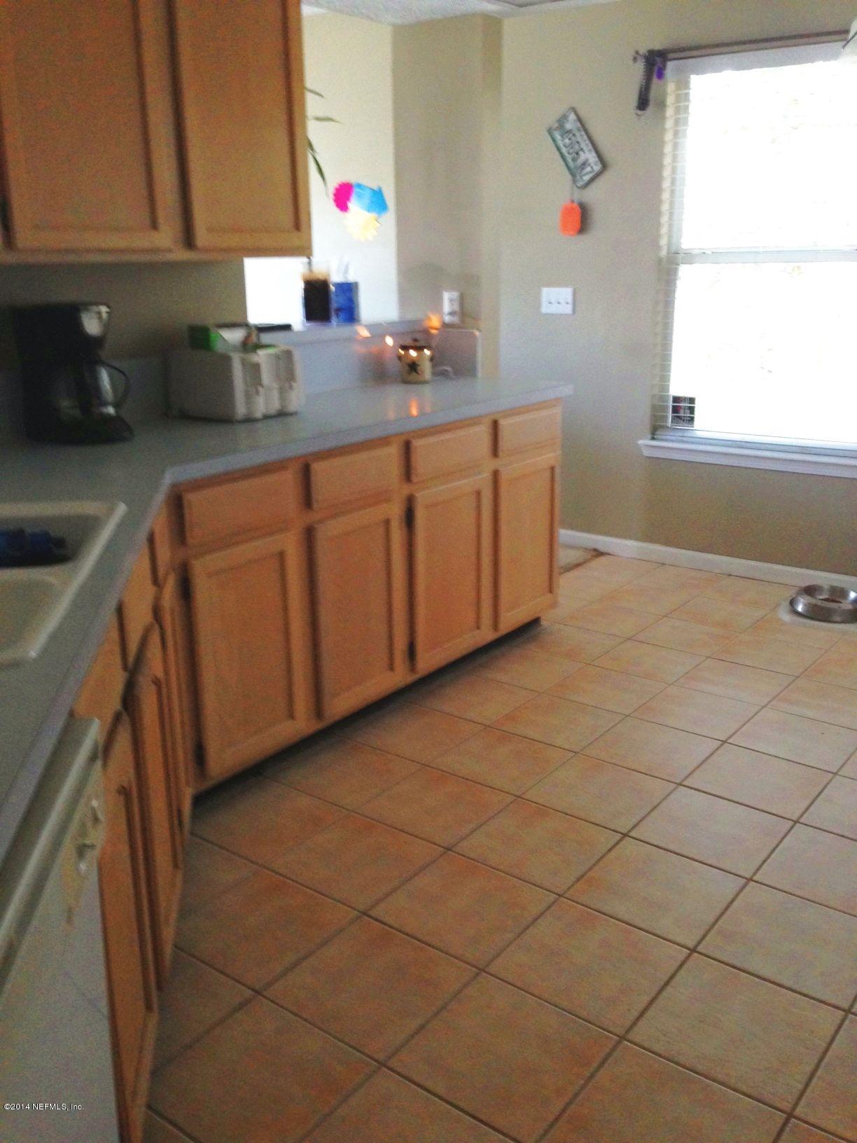 438 Federal Hill Road Orange Park, FL 32073 - Photo 2 of 14 a kitchen with stainless steel appliances a sink and a cabinets