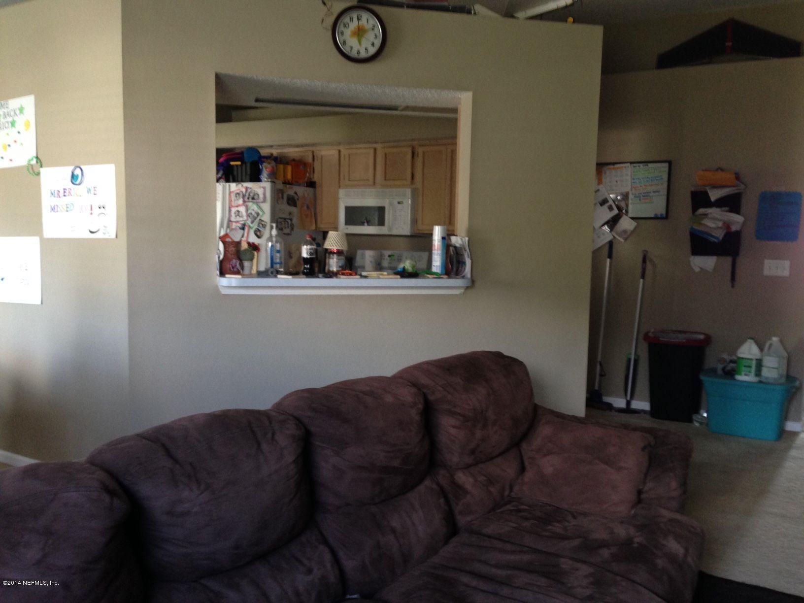 438 Federal Hill Road Orange Park, FL 32073 - Photo 4 of 14 a living room with furniture and a mirror