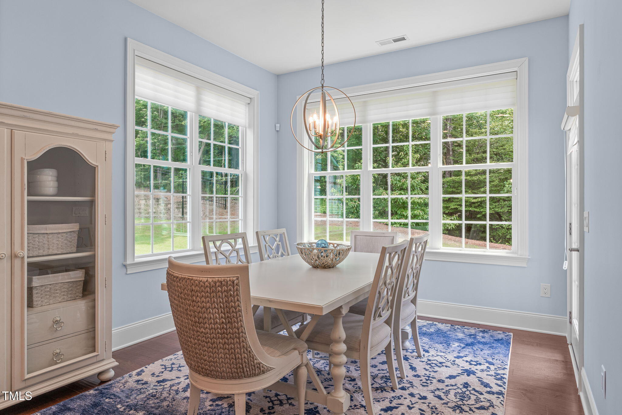 2511 Range Overlook Crossing Apex, NC 27523 - Photo 23 of 50 a dining room with furniture window and outside view