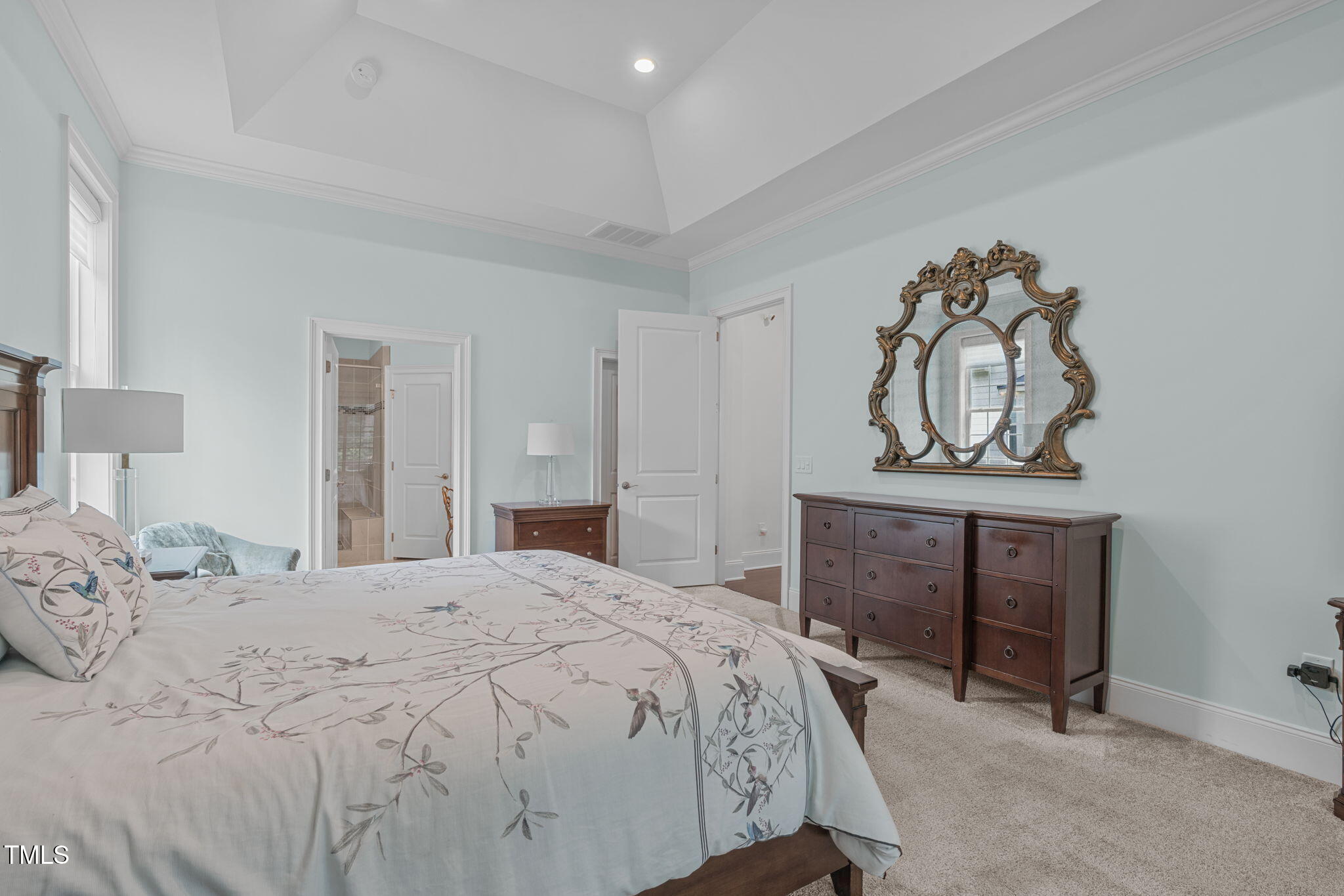 2511 Range Overlook Crossing Apex, NC 27523 - Photo 26 of 50 a bedroom with a bed and a dresser