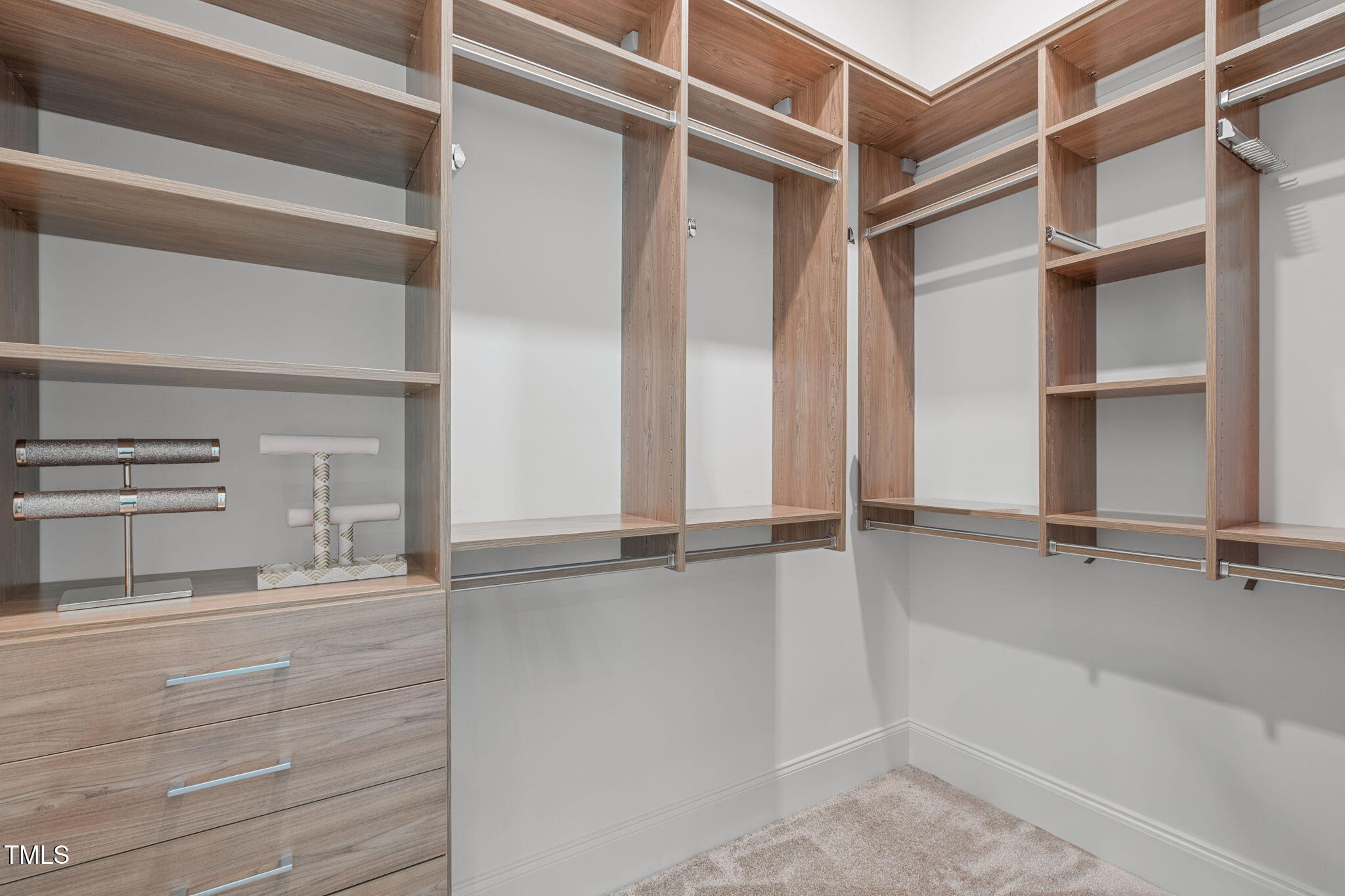 2511 Range Overlook Crossing Apex, NC 27523 - Photo 31 of 50 a view of walk in closet with empty racks