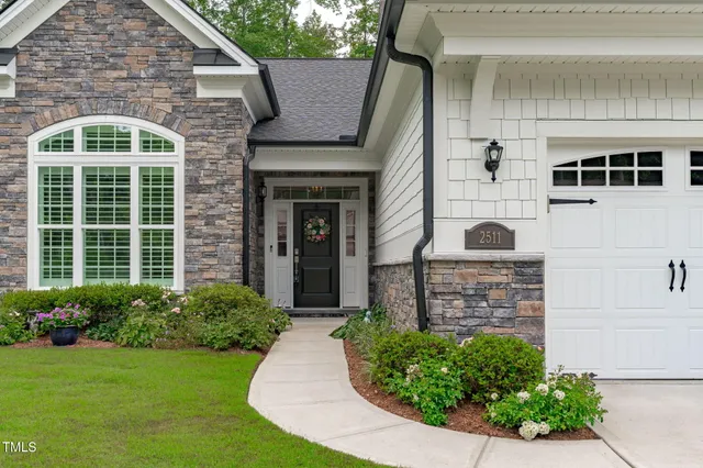 a front view of a house with garden