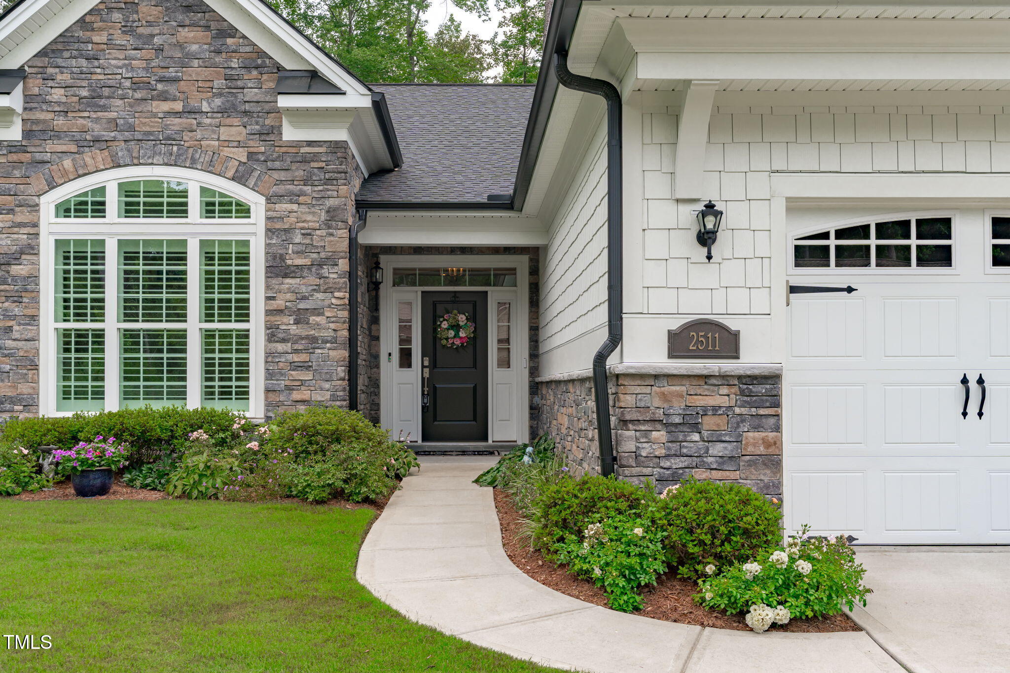 2511 Range Overlook Crossing Apex, NC 27523 - Photo 3 of 50 a front view of a house with garden