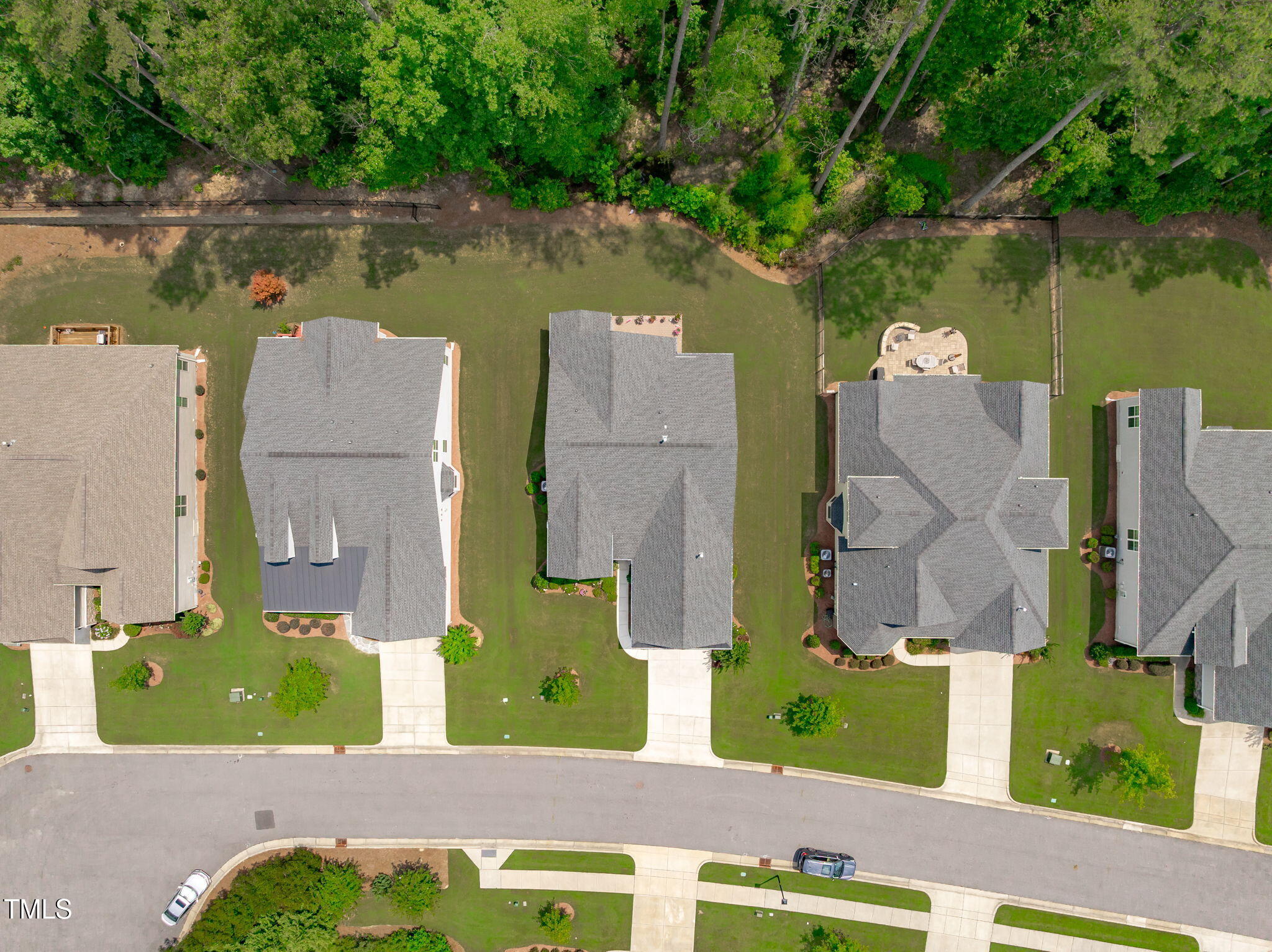 2511 Range Overlook Crossing Apex, NC 27523 - Photo 44 of 50 an aerial view of a house with a garden and lake view