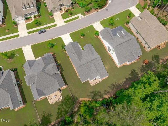 an aerial view of houses with yard