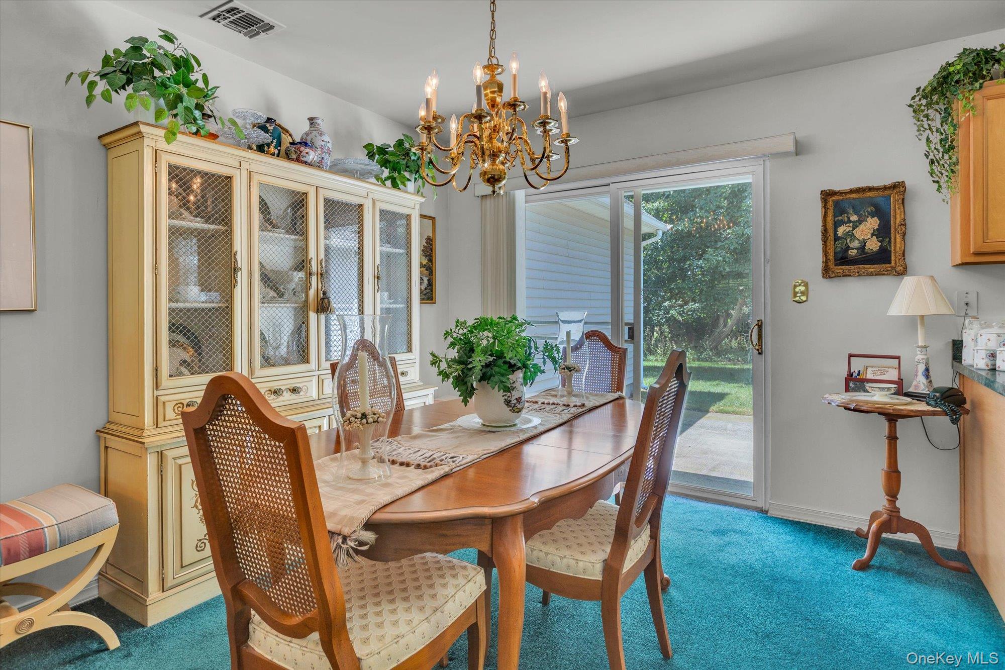 702 Pebble Beach Path Riverhead, NY 11901 - Photo 4 of 17 Dining Room. Access to the back patio and back yard.