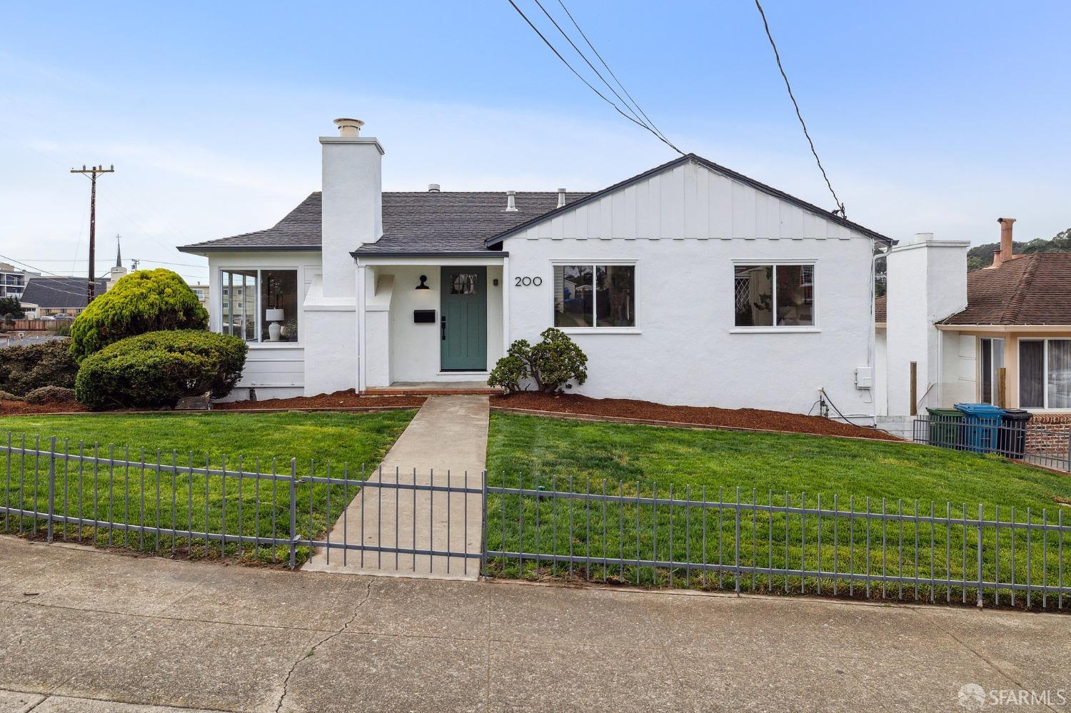 200 Garden Lane Daly City, CA 94015 - Photo 1 of 81 a front view of a house with a yard