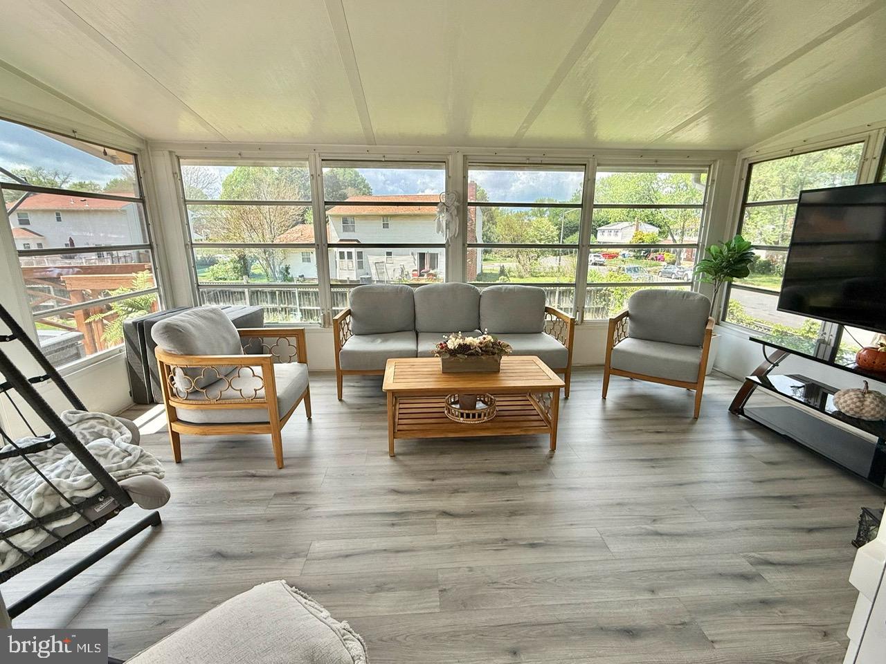 4082 Braxton Road Chantilly, VA 20151 - Photo 11 of 40 a living room with furniture and a flat screen tv