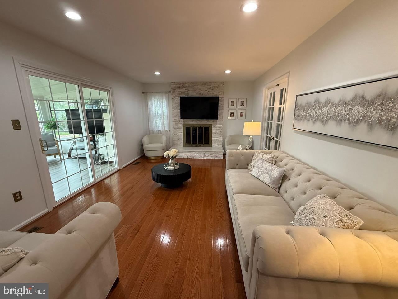 4082 Braxton Road Chantilly, VA 20151 - Photo 2 of 40 a living room with furniture and a flat screen tv