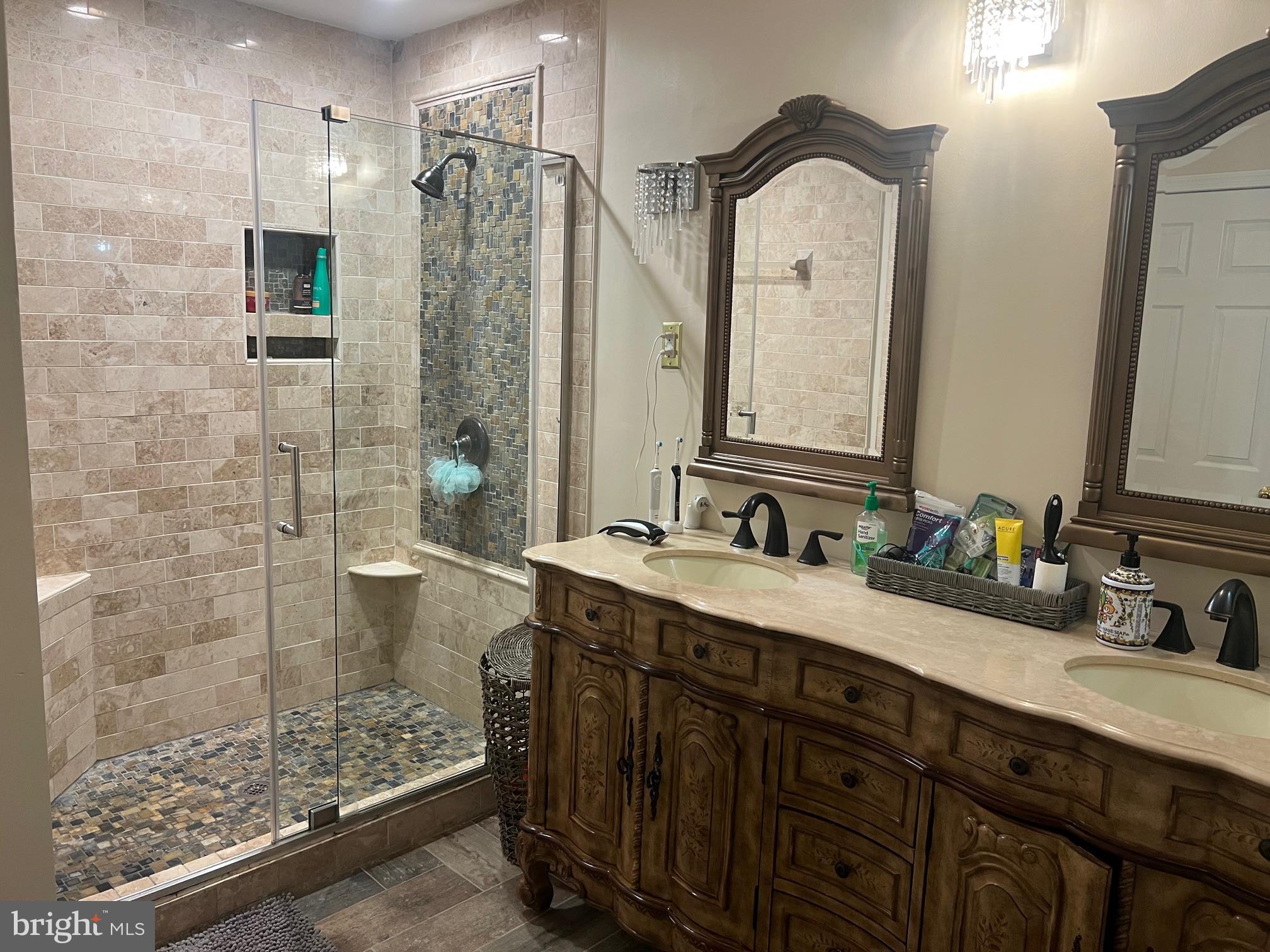 4082 Braxton Road Chantilly, VA 20151 - Photo 22 of 40 a bathroom with a double vanity sink mirror and shower