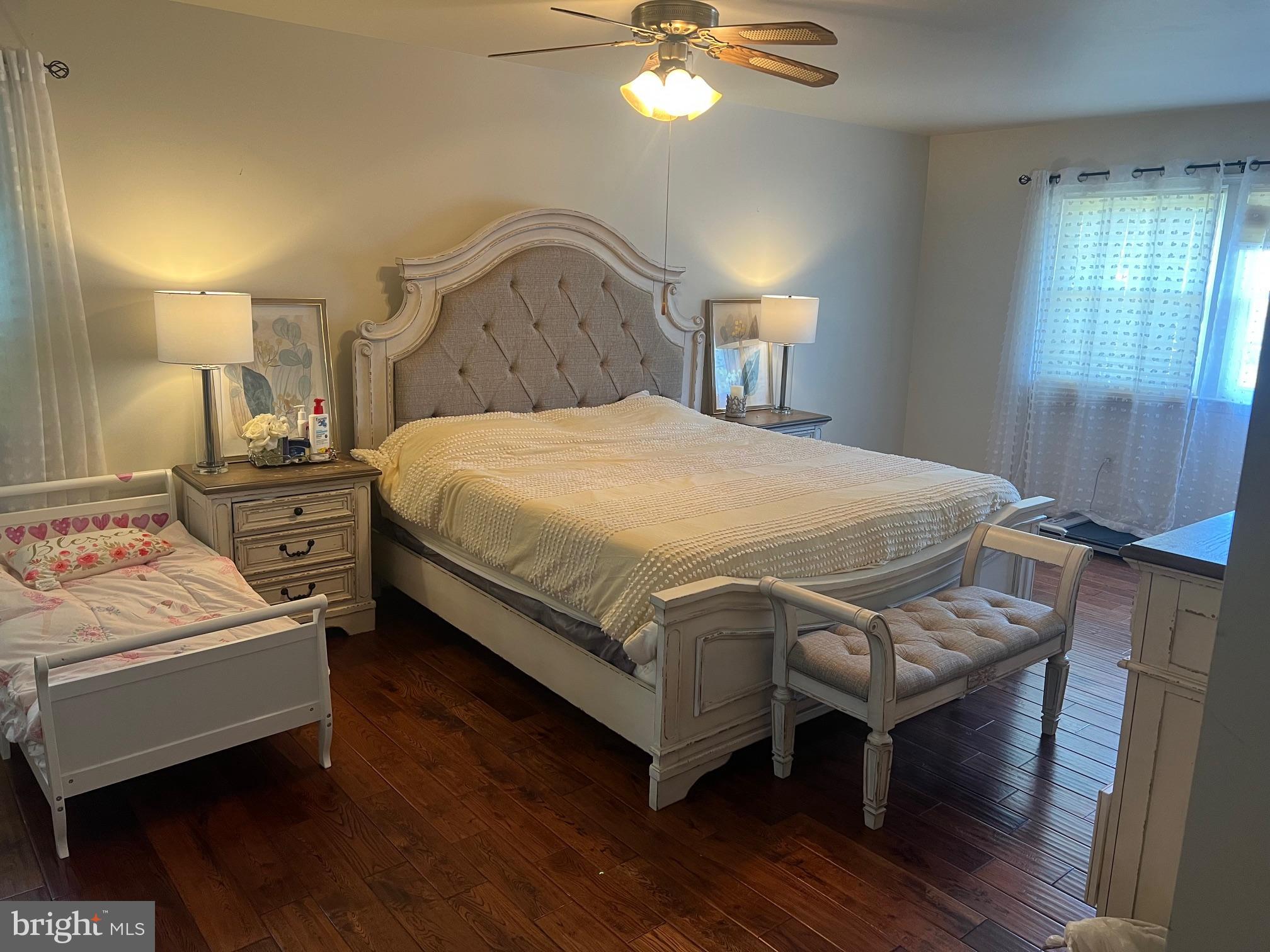 4082 Braxton Road Chantilly, VA 20151 - Photo 27 of 40 a bedroom with a bed a chandelier and dresser