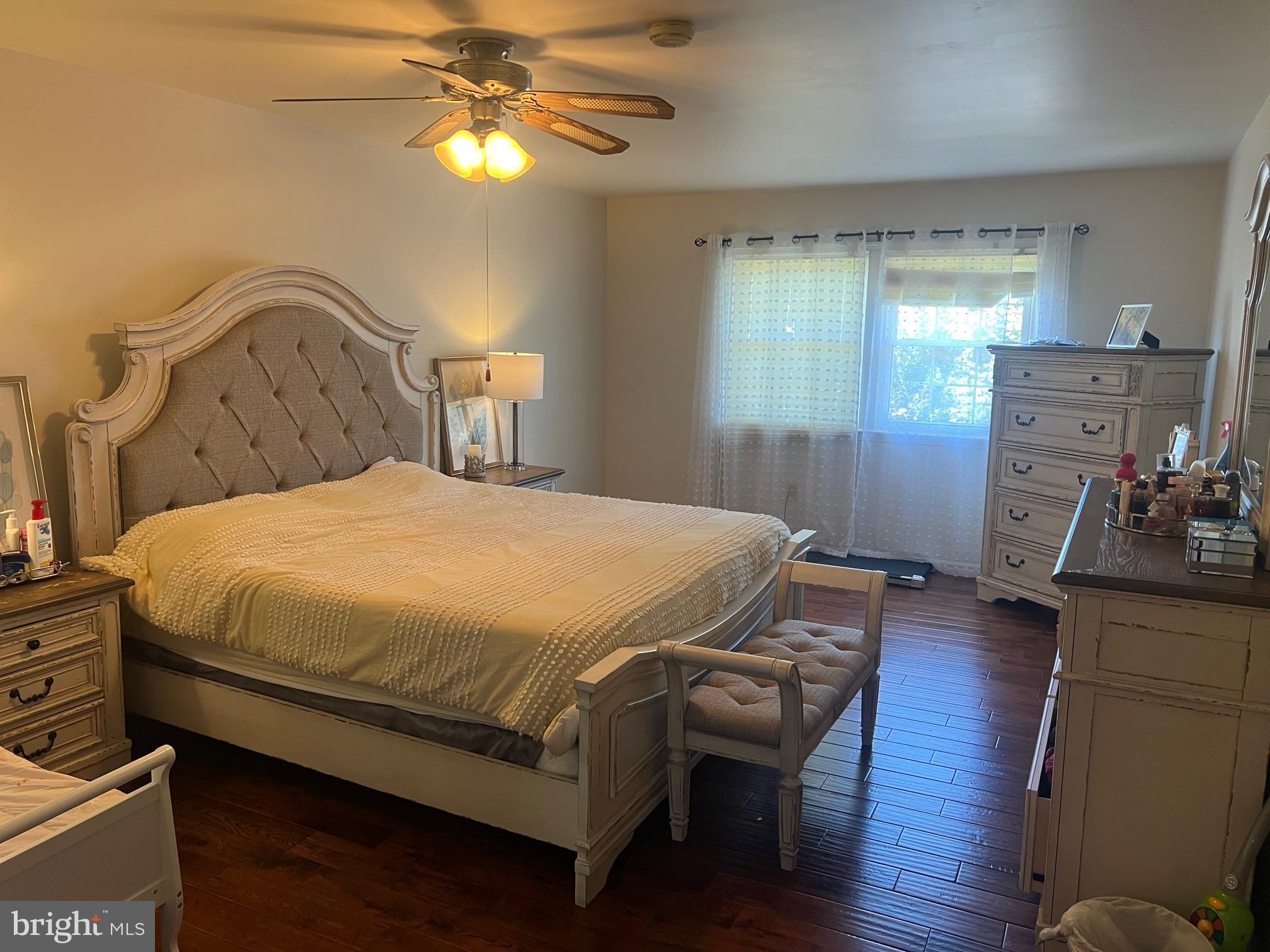 4082 Braxton Road Chantilly, VA 20151 - Photo 28 of 40 a bedroom with a bed and dresser with mirror
