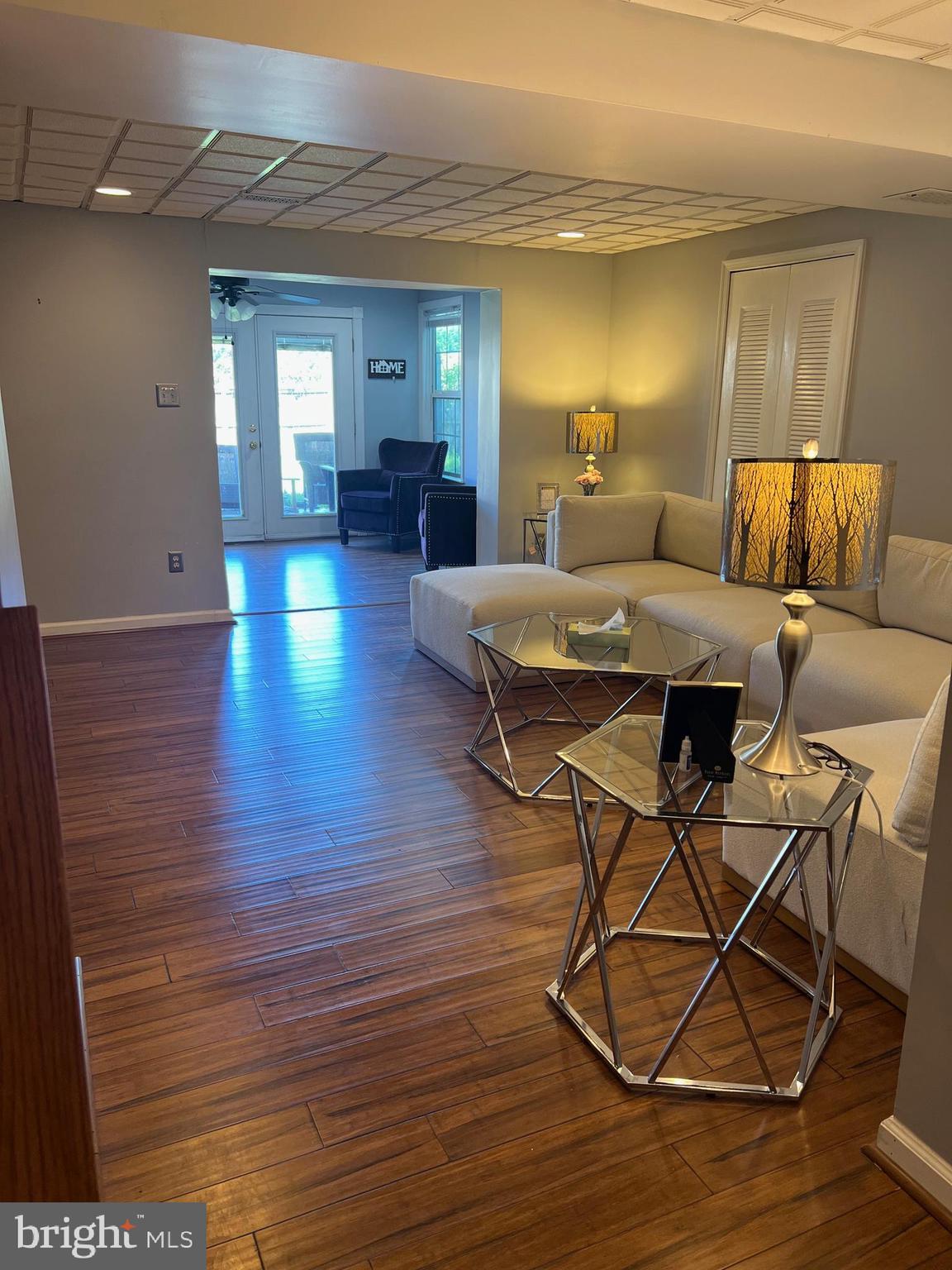 4082 Braxton Road Chantilly, VA 20151 - Photo 32 of 40 a living room with furniture and a wooden floor