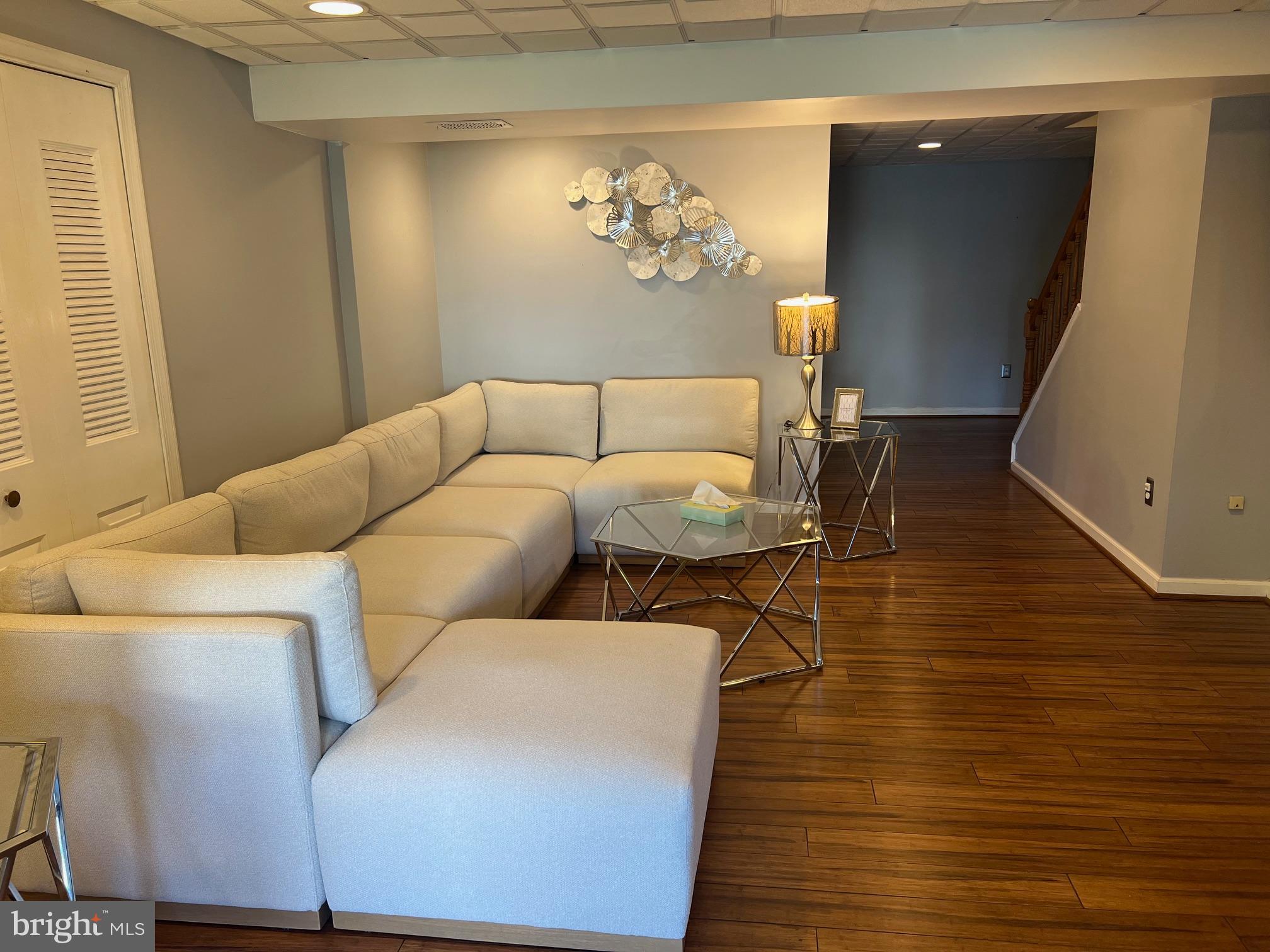 4082 Braxton Road Chantilly, VA 20151 - Photo 34 of 40 a living room with couches chairs and wooden floor