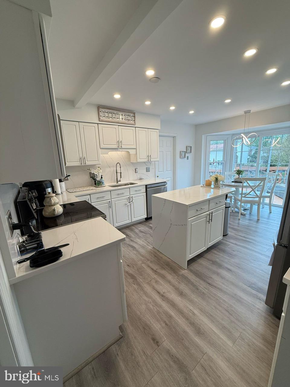 4082 Braxton Road Chantilly, VA 20151 - Photo 7 of 40 a living room with stainless steel appliances kitchen island granite countertop a refrigerator a sink dishwasher and a stove with wooden floor