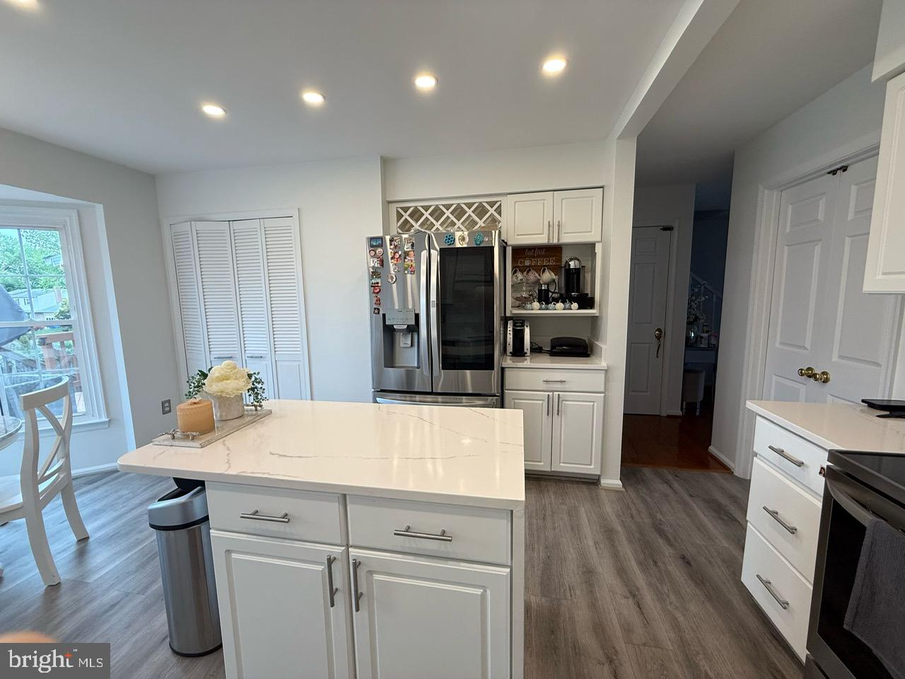 4082 Braxton Road Chantilly, VA 20151 - Photo 9 of 40 a kitchen with granite countertop a refrigerator and a stove top oven