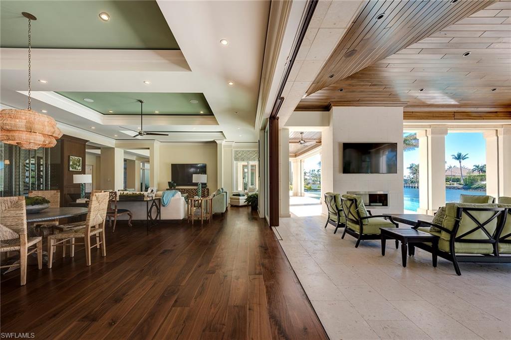 3450 Rum Row Naples, FL 34102 - Photo 11 of 25 a living room with lots of furniture and white walls