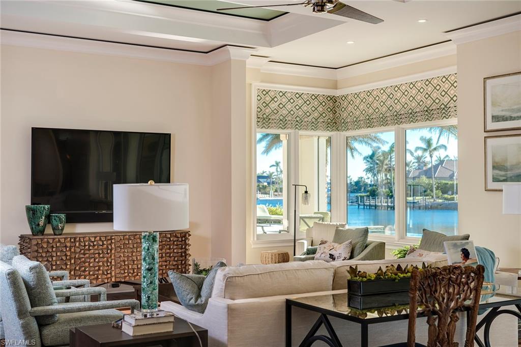 3450 Rum Row Naples, FL 34102 - Photo 13 of 25 a living room with furniture and a window