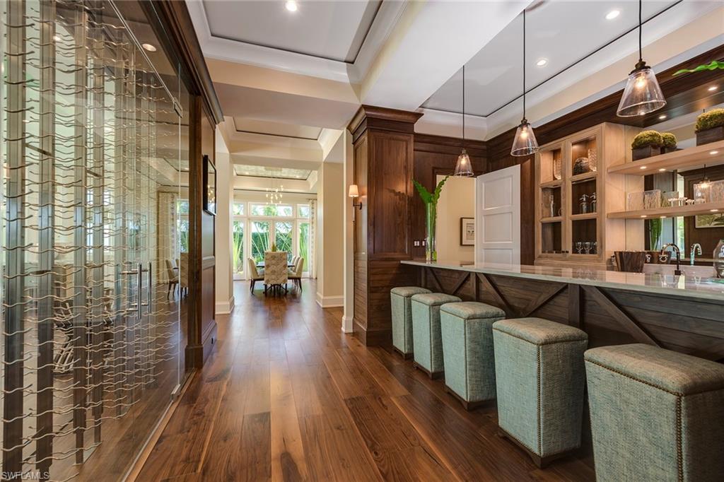 3450 Rum Row Naples, FL 34102 - Photo 18 of 25 a living room with furniture and a wooden floor