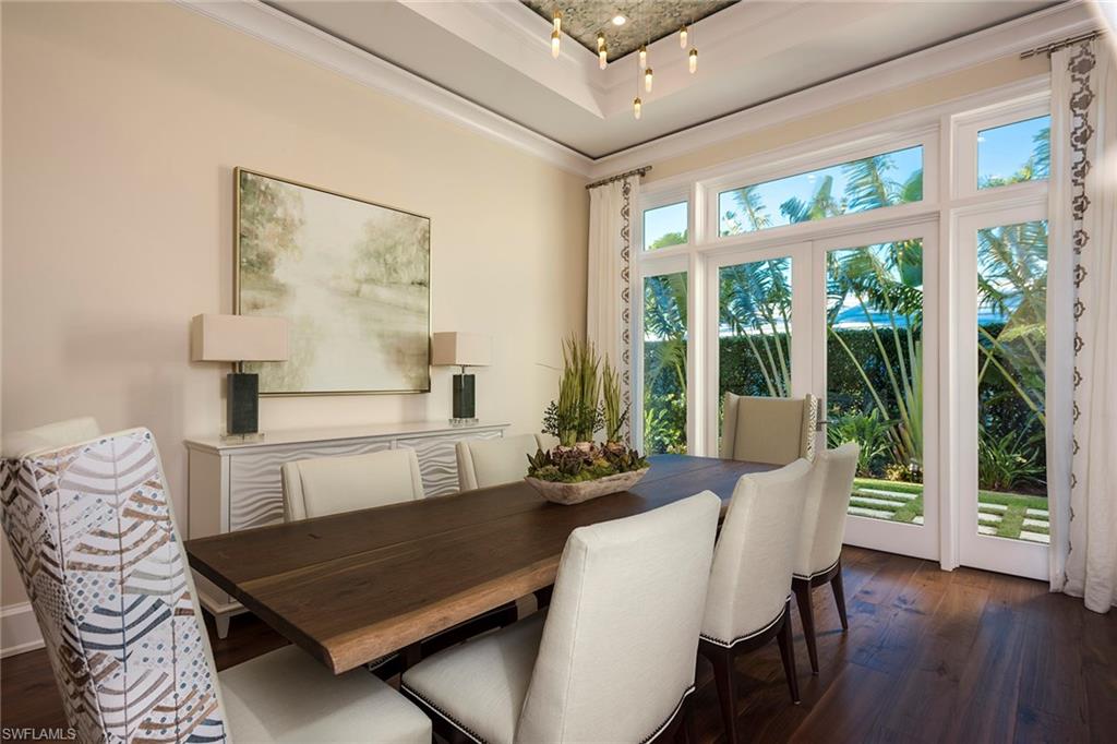 3450 Rum Row Naples, FL 34102 - Photo 19 of 25 a living room with furniture and wooden floor