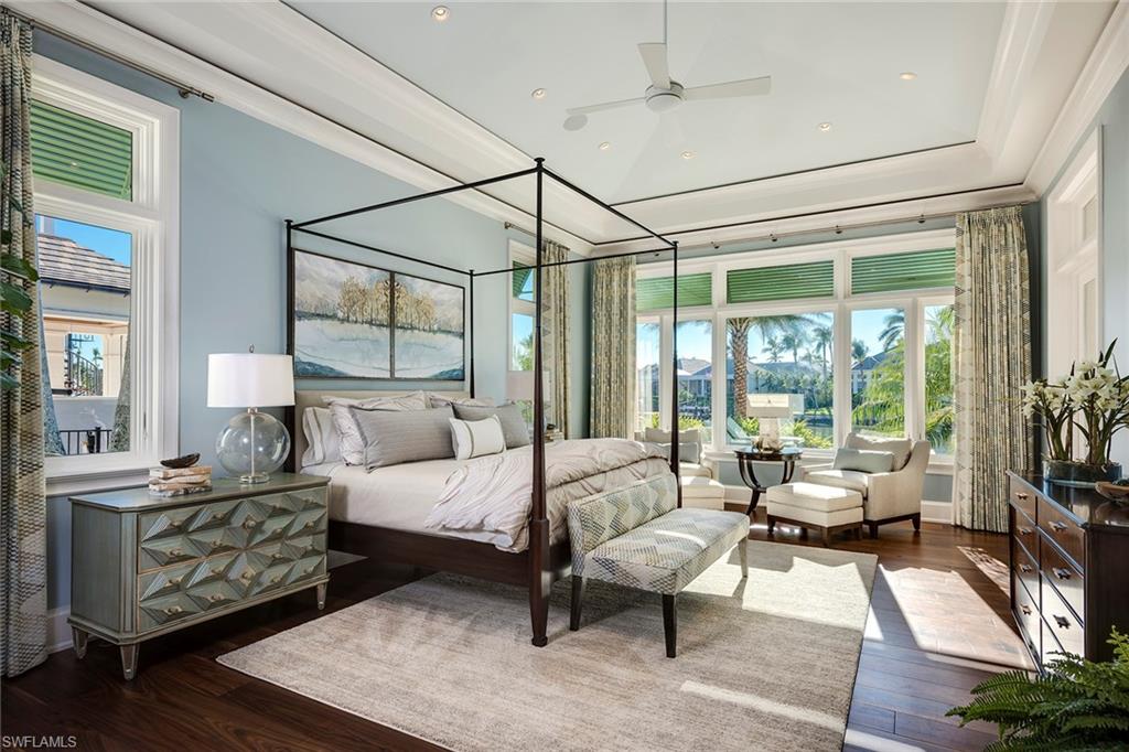 3450 Rum Row Naples, FL 34102 - Photo 21 of 25 a bedroom with furniture and large windows