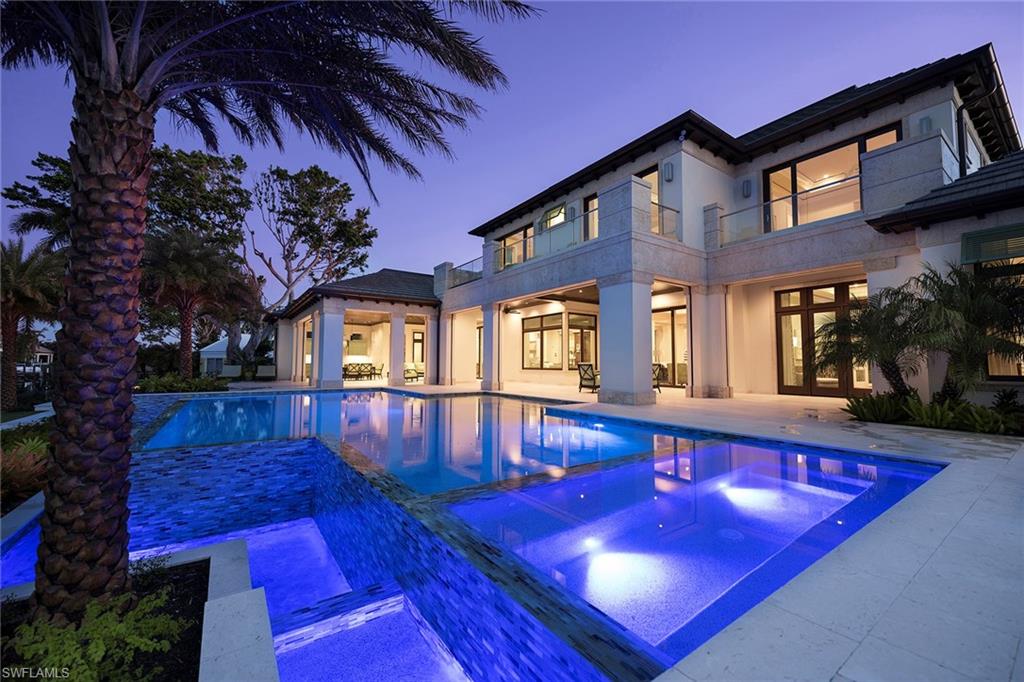 3450 Rum Row Naples, FL 34102 - Photo 4 of 25 a view of a house with pool and sitting area