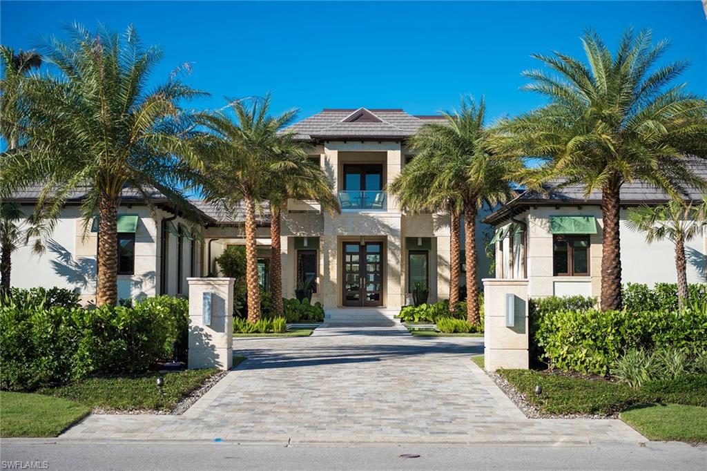 3450 Rum Row Naples, FL 34102 - Photo 8 of 25 front view of a house with a garden