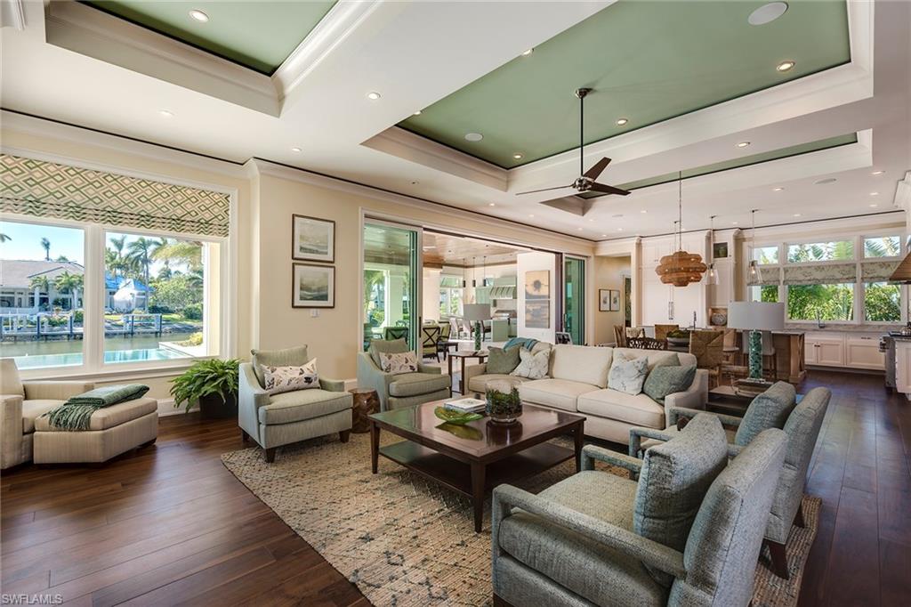3450 Rum Row Naples, FL 34102 - Photo 10 of 25 a living room with furniture and a large window