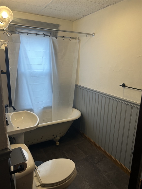 29 Tatman Street Worcester, MA 01607 - Photo 22 of 42 a bathroom with a sink a toilet a mirror and shower