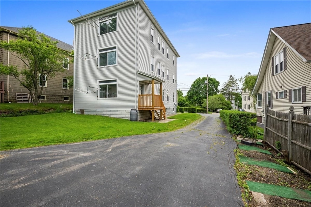 29 Tatman Street Worcester, MA 01607 - Photo 31 of 42 a view of a house with a yard and pathway