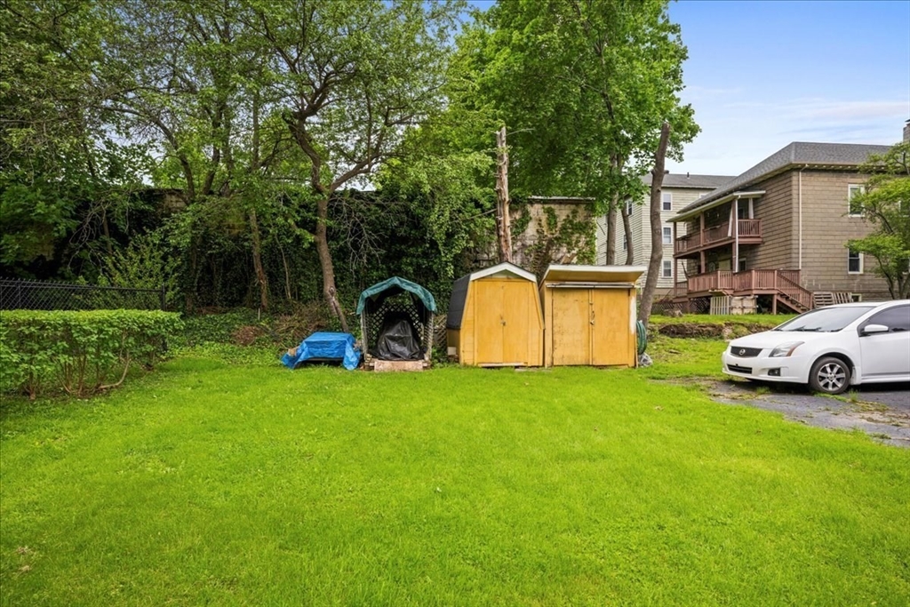 29 Tatman Street Worcester, MA 01607 - Photo 39 of 42 a view of a backyard with a garden and entertaining space