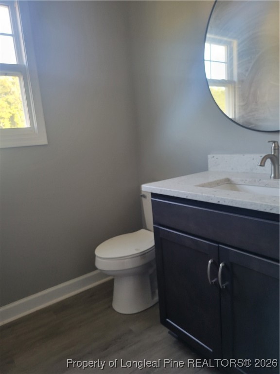 2960 H Clark Road Fayetteville, NC 28306 - Photo 11 of 33 a bathroom with a toilet a sink and mirror