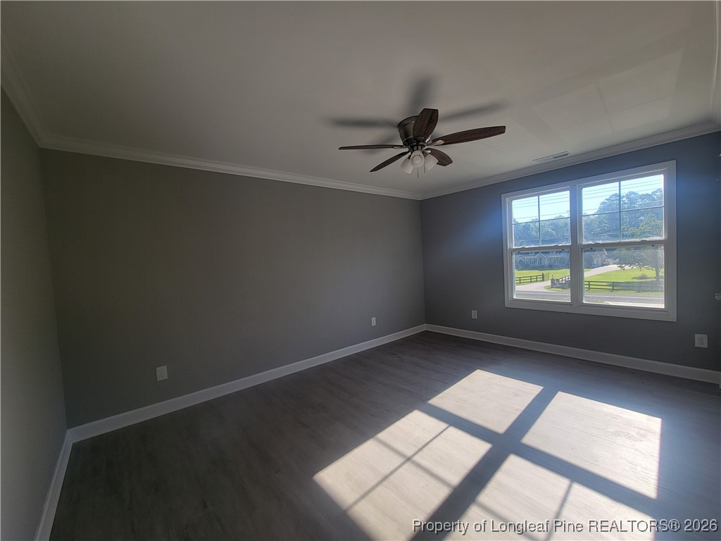 2960 H Clark Road Fayetteville, NC 28306 - Photo 20 of 33 an empty room with windows and ceiling fan