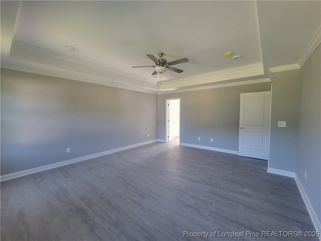 2960 H Clark Road Fayetteville, NC 28306 - Photo 26 of 33 an empty room with wooden floor and fan