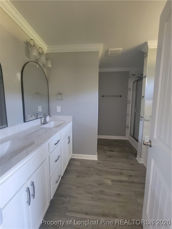 2960 H Clark Road Fayetteville, NC 28306 - Photo 27 of 33 a bathroom with a double vanity sink and mirror