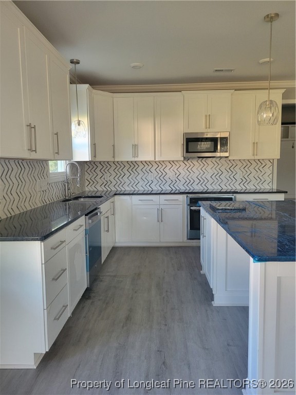 2960 H Clark Road Fayetteville, NC 28306 - Photo 6 of 33 a kitchen with stainless steel appliances granite countertop a sink and cabinets
