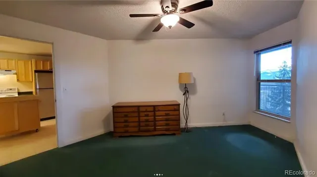a view of room with stairs and a window