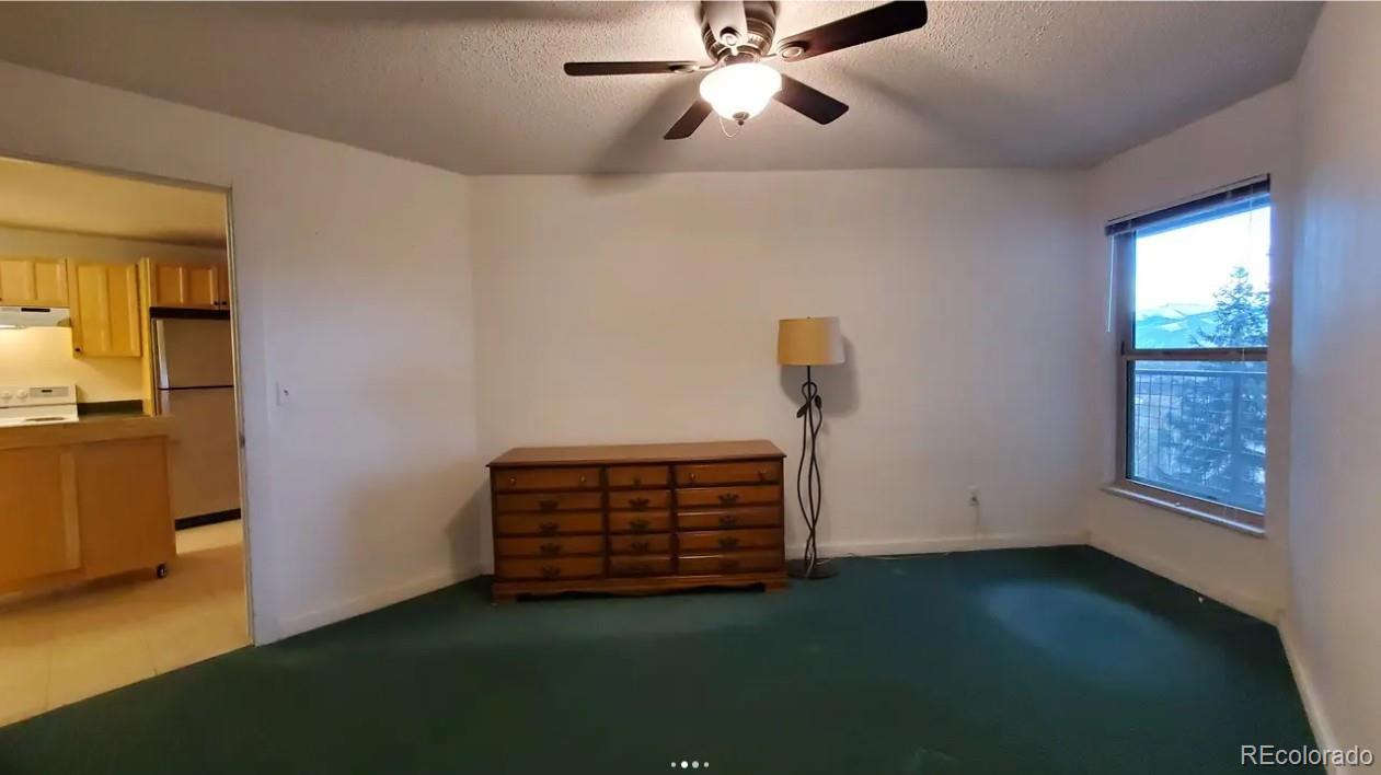 7223 Ryan Gulch Road Silverthorne, CO 80498 - Photo 16 of 20 a view of room with stairs and a window