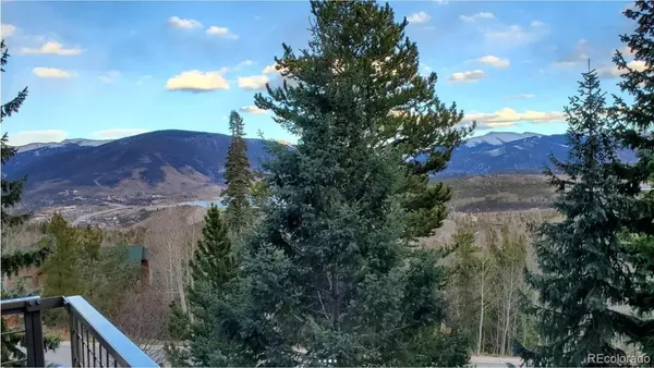 a view of a house with a mountain in the background
