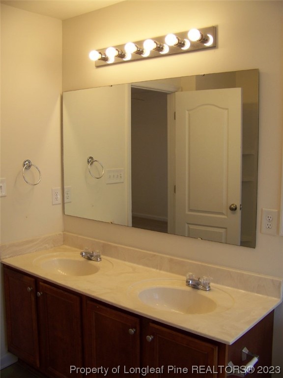 92 Cobblestone Drive Spring Lake, NC 28390 - Photo 16 of 24 a bathroom with a sink and a mirror