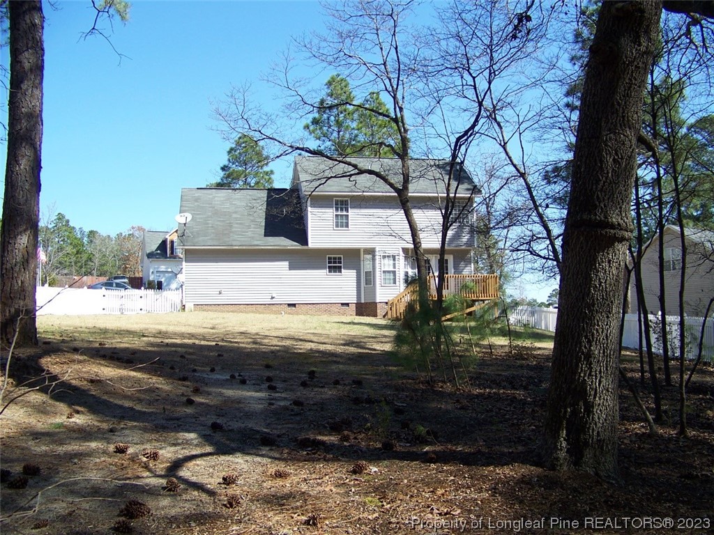 92 Cobblestone Drive Spring Lake, NC 28390 - Photo 21 of 24 a view of a house with a yard