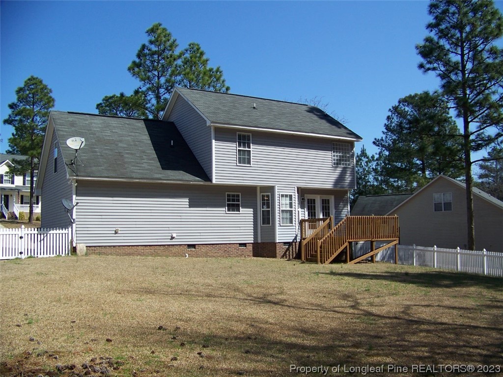 92 Cobblestone Drive Spring Lake, NC 28390 - Photo 22 of 24 a view of a house with a yard