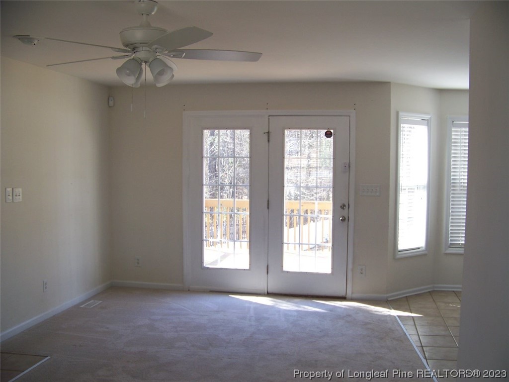 92 Cobblestone Drive Spring Lake, NC 28390 - Photo 5 of 24 an empty room with windows and fan