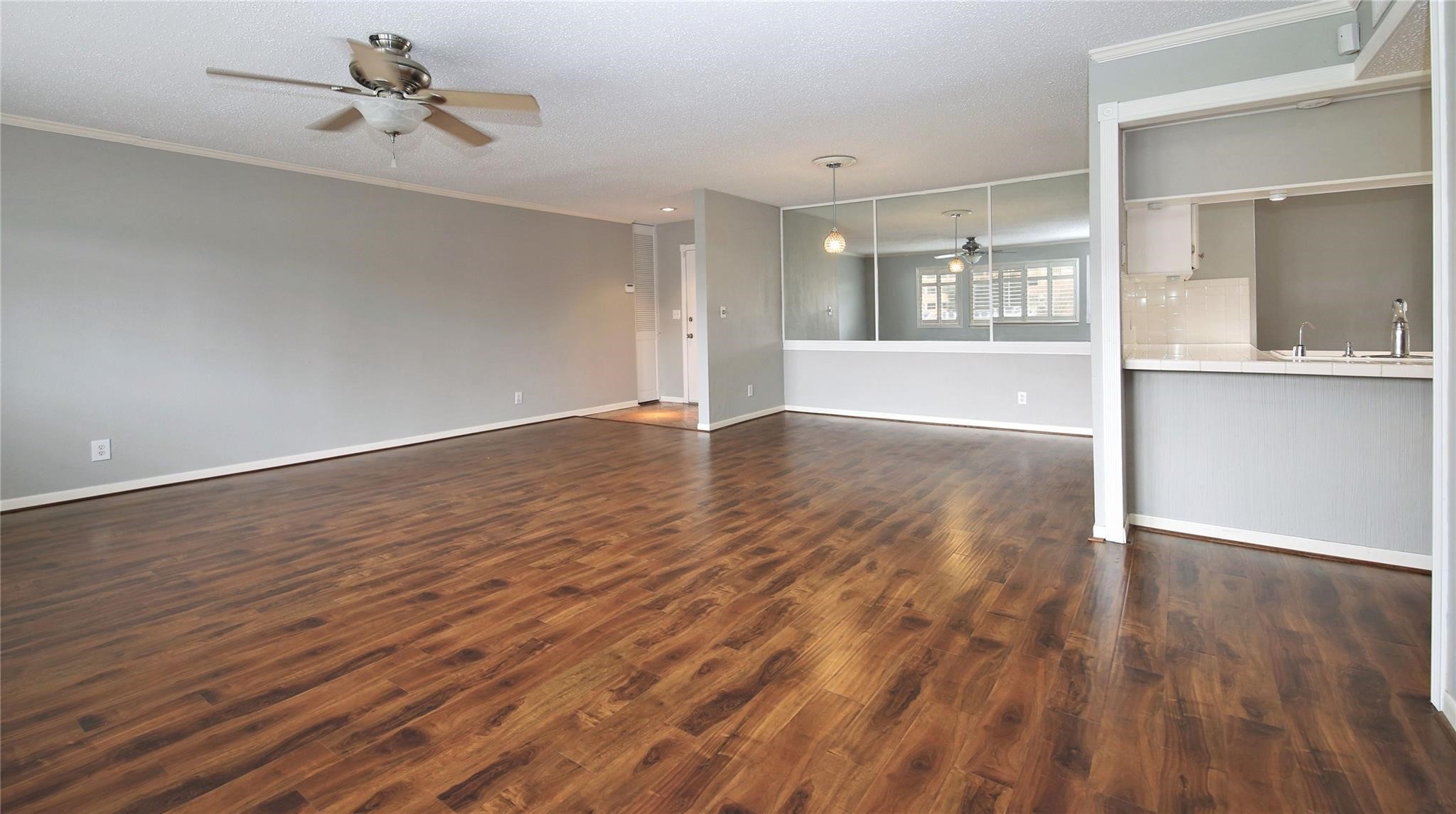 6433 Bayou Glen Road, Unit 6433 Houston, TX 77057 - Photo 16 of 19 wooden floor in an empty room with a window
