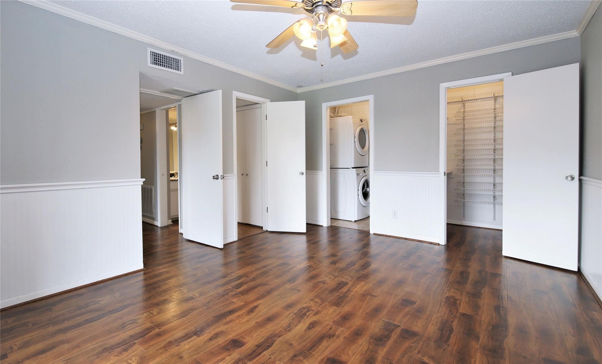 6433 Bayou Glen Road, Unit 6433 Houston, TX 77057 - Photo 6 of 19 an empty room with wooden floor and windows